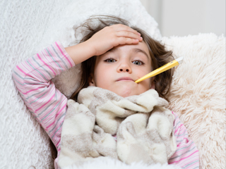 Child with thermometer in mouth