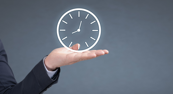 Illuminated clock above a hand